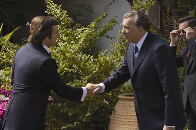 David Frost (Michael Sheen) greets Richard Nixon (Frank Langella) and Colonel Jack Brennan (Kevin Bacon) in 