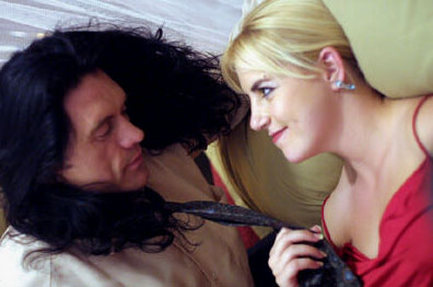 Tommy Wiseau and Juliette Danielle star in The Room.