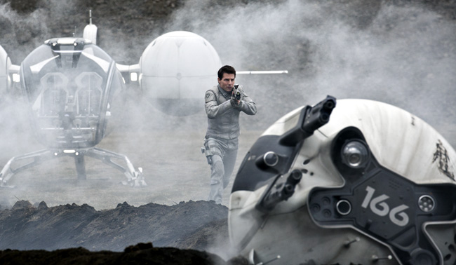 Tom Cruise cautiously approaches a drone in Oblivion