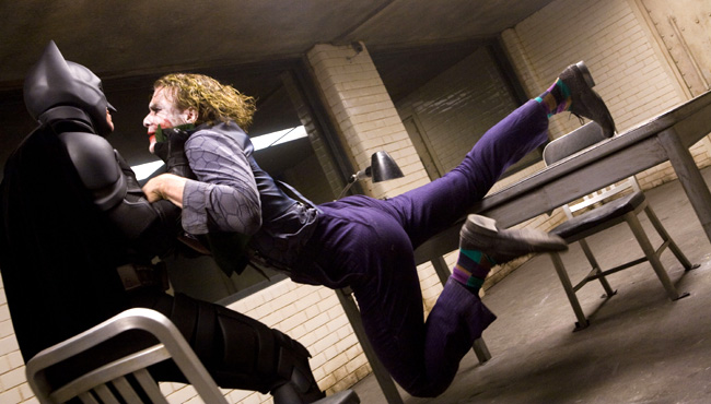 Christian Bale (left) stars as Batman and Heath Ledger (right) stars as the Joker in The Dark Knight