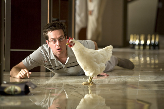 Stu (Ed Helms) wakes up with a hangover and finds a chicken in his hotel room in The Hangover